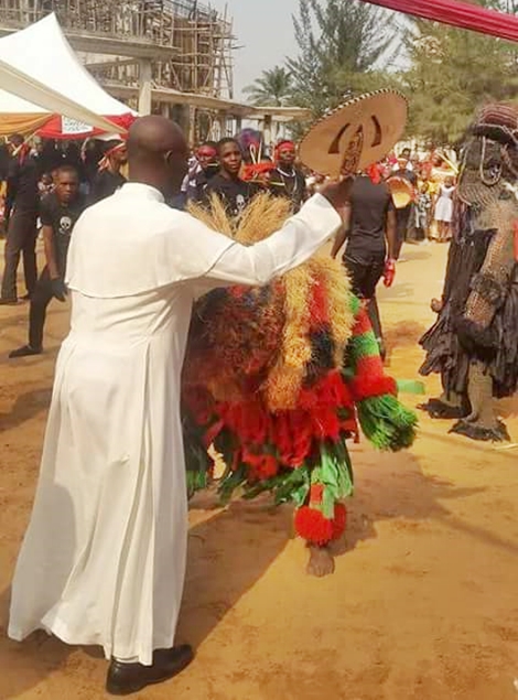 Photos Of A Catholic Priest Spotted Dancing With Local Masquerades In ...