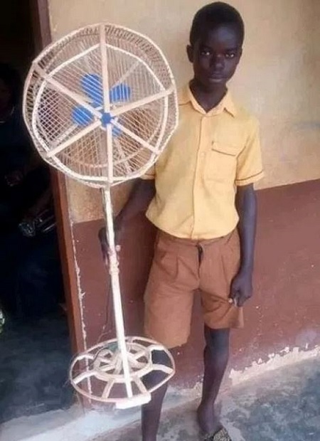 Teenage pupil who built a standing fan with wood