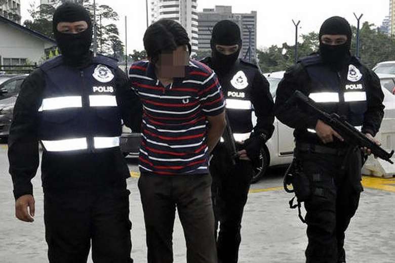 File photo: Police arresting a suspect