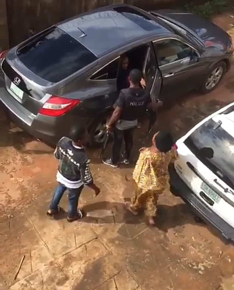 Nursing mother being arrested by the police