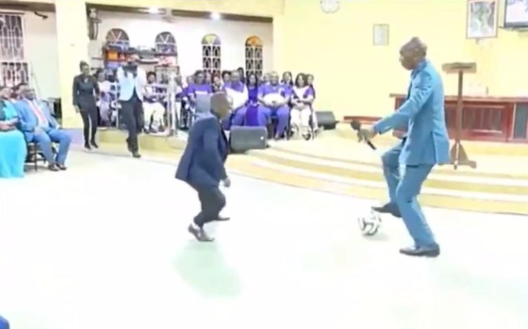 Pastor performing deliverance on church members with football