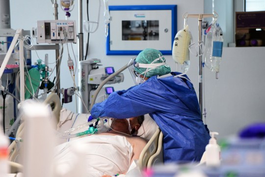 A medical worker treats a patient in Lombardy, Italy (AFP via Getty Images)