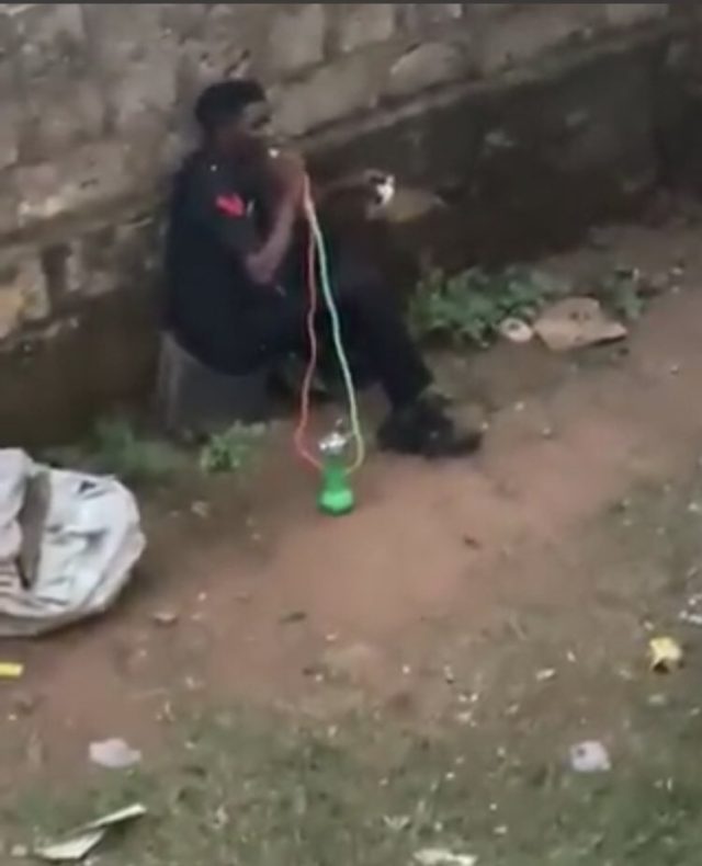 Policeman smoking shisha