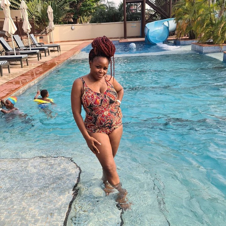 Omawumi posing in a swimsuit