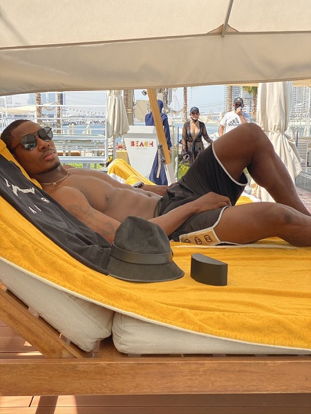 Odion Ighalo cools off by the sea